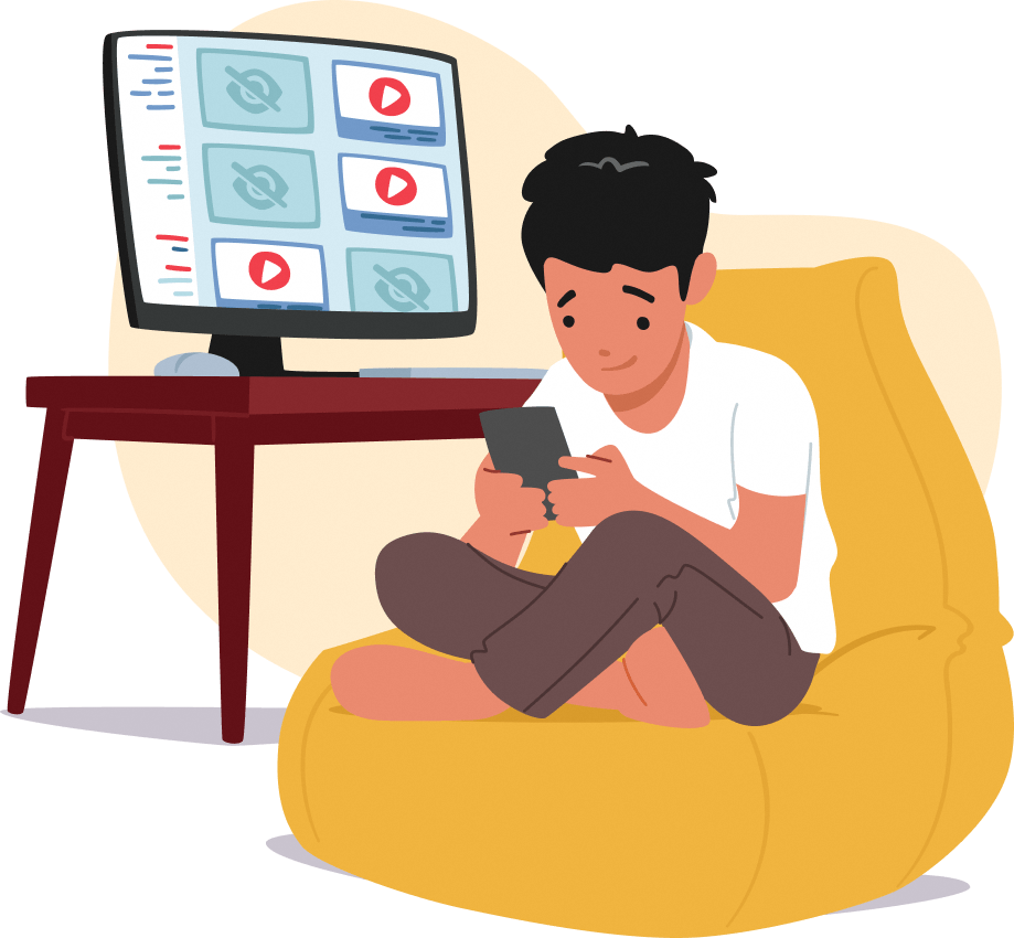 A boy sitting in the chair and using his phone