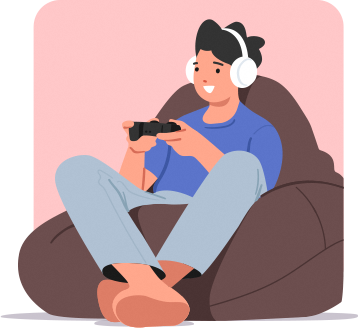 A boy sitting down and using his phone while on headphones